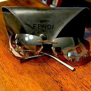 Fendi sunglasses.  Like new.  Case shows sone wear, but sunglasses are like new.